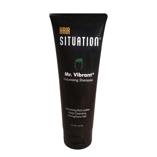 Black tube of men's volumizing shampoo labeled Mr. Vibrant, 8 fl oz, for hair care.