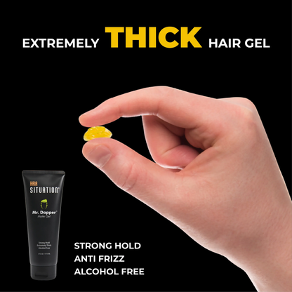 Hand holding yellow thick hair gel with black tube