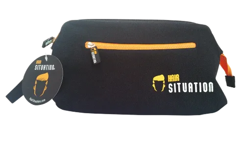 Men’s black grooming toiletry bag with orange zipper and Hair Situation logo