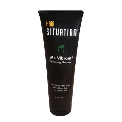 Black tube of men's volumizing shampoo labeled Mr. Vibrant, 8 fl oz, for hair care.