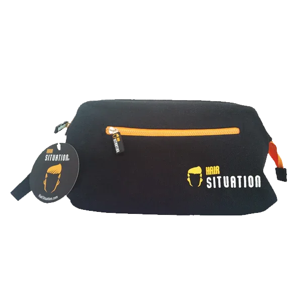 Black toiletry bag open showing spacious main compartment and expandable wire frame
